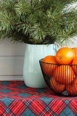 Christmas oranges and pine branches creating festive atmosphere