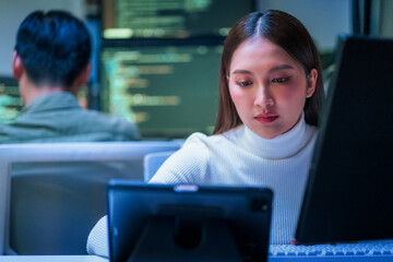 Asian programmer leverages generative AI assistance for deep learning and data driven analysis, optimizing a scalable, cloud native workflow in their modern, hyper automated smart office