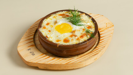 Fried egg in ceramic pot