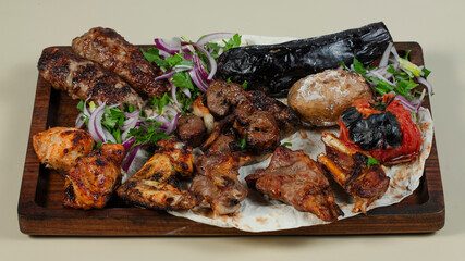 Kebab assortment on wooden tray