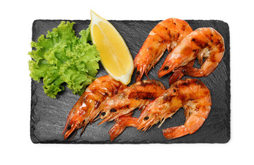 Tasty grilled shrimps with lemon and lettuce isolated on white, top view. Delicious seafood dish