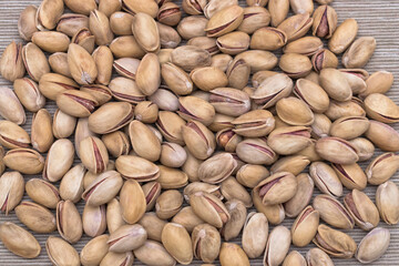 Close-up of dried pistachio kernels, healthy protein rich nuts.