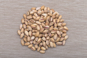 Roasted salted pistachios in shells, traditional snack food.