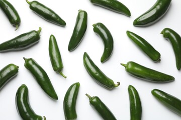 Green jalapeno peppers on white background, flat lay