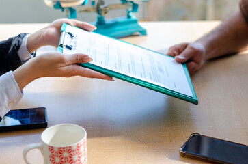Document and man compensation paperwork, insurance, legal contract or lawyer consulting. Disability...