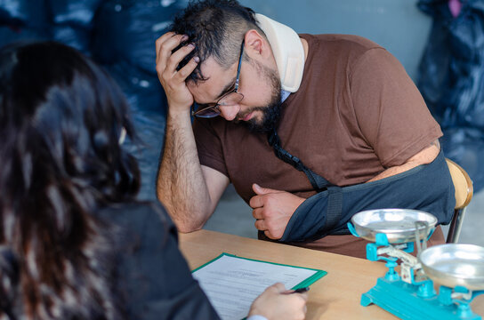 Man grabbing his head. Lawyer assist injured man with legal advice. Insurance payment, accident compensation.