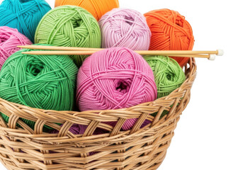 Colorful yarn balls and knitting needles in a woven basket isolated on transparent background
