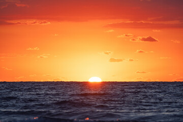 Beautiful sunrise over the sea horizon