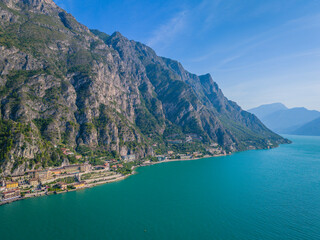 Obraz premium Limone sul Garda. Aerial view of panoramic Garda lake and Italian Alps mountains. Lombardy drone landscape