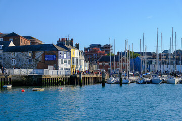 Fototapeta premium Weymouth Harbour and entrance showing boats moored and marina.