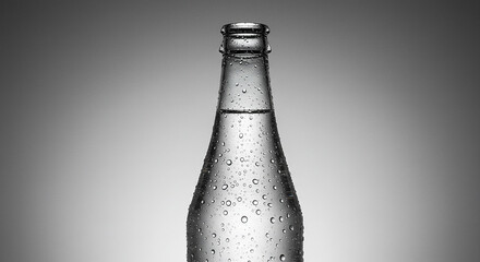 Close up of a clear glass bottle filled with water and condensation droplets
