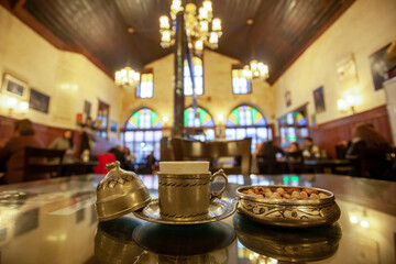 Ottoman Style Turkish Coffee with Nuts in Vintage Café Interior