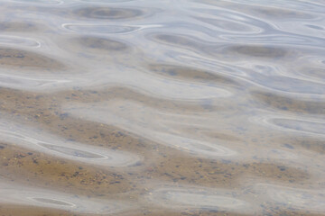 Crystal Clear Lake Wave Revealing Sandy Bottom &ndash; Tranquil Water Texture Background