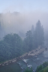 fog in the mountains houses at altitude green forest summer