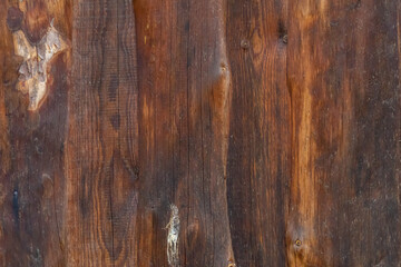 Naklejka premium Weathered Wooden Wall of a Rustic Country Barn – Vintage Rural Texture Background