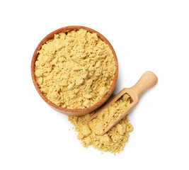 Dry powdered mustard in bowl and scoop isolated on white, top view