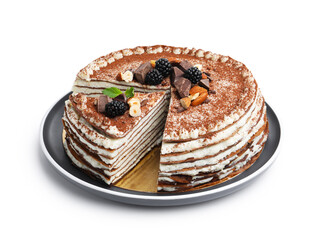 Tasty crepe cake with cocoa powder, chocolate, nuts, blackberries and mint isolated on white