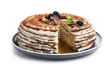 Tasty crepe cake with cocoa powder, chocolate, nuts, blackberries and mint isolated on white