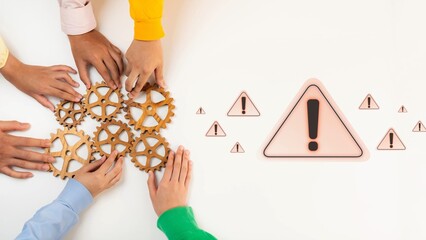 Obraz premium This image shows diverse hands collaborating with gears, highlighting teamwork and the importance of caution with warning signs in a business environment. Raster
