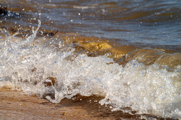 Wave Splash on the Rocks. Powerful sea wave crashing onto rocks.