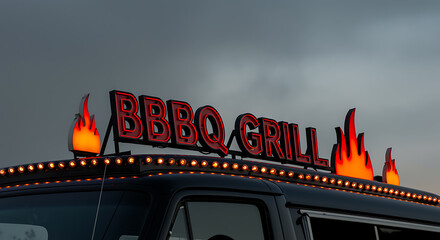 Red neon B Q Grill sign with flame lights on dark vehicle