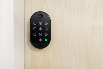 Smart lock keypad installed on wooden door. Modern digital security solution for smart homes, providing safe access control and innovative technology convenience