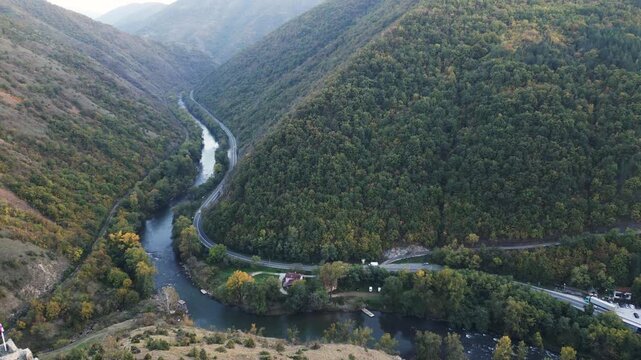 Aerial footage unveils river Ibar and Maglic medieval fortress located in south-western Serbia. Flying backwards.