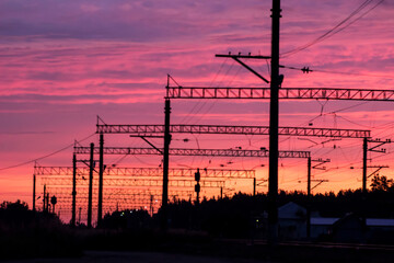railway poles on the background of sunset. railway. farewell. colorful sunset. the railway infrastructure.