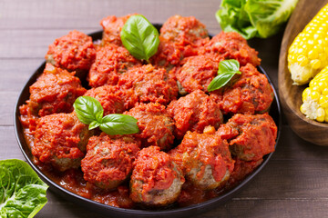 Juicy pan seared beef meatballs with tomato sauce