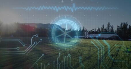 Displaying central circular gauge overlaying farmland with sun glare lens flare, with barn silos