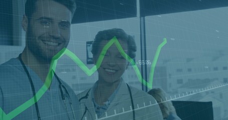 Standing medical professionals analyzing data in clinic, with stethoscopes and green graph overlay