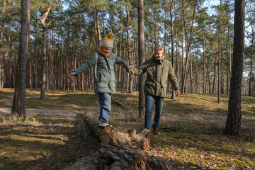 Dad And Daughter Walking In The Forest In Spring