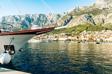 Amazing beach with boats on  azure sea in Makarska Riviera, Dalmatia region of Croatia.