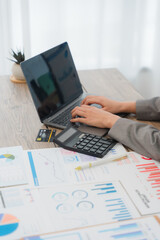 Fototapeta premium Financial Analysis with Laptop and Charts