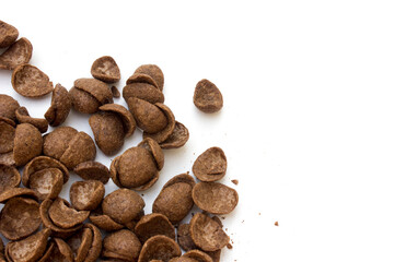 Chocolate corn flakes on a white background. Delicious nutritious Breakfast for the child