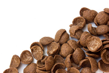 Chocolate corn flakes on a white background. Delicious nutritious Breakfast for the child