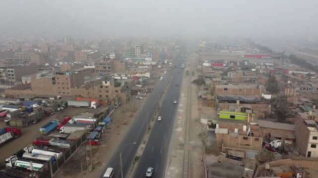 Foggy urban landscape over ramiro priale highway in lima, peru