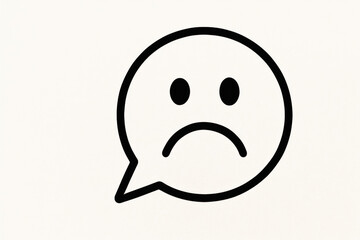 Fototapeta premium A sad emoji in a dialogue cloud on a light background. Space for text.