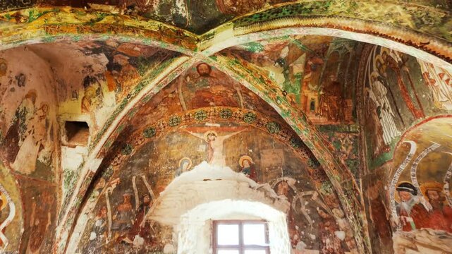 Painted chapel of Harman fortified church, Brasov, Transylvania, Romania, with vivid frescoes, stone walls and a quiet nave within the historic enclosure
