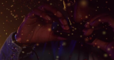 Tobacco hands arranging onto paper, rolling, lighting tip, inhaling with floating golden particles - Powered by Adobe