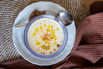 Homemade recipe for white vegetable cream soup with almonds