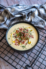 Homemade recipe for white vegetable cream soup with ham