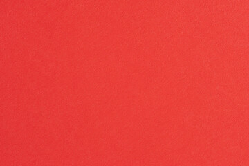 Red paper texture or background for design with copy space for text or image.