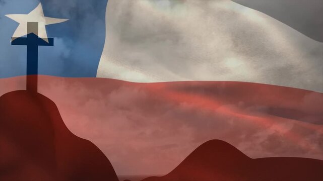 Breeze blowing triggers Chilean flag billowing across dark hills and cross to show national pride
