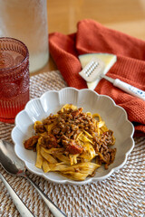 homemade recipe for pasta with Bolognese sauce and cheese