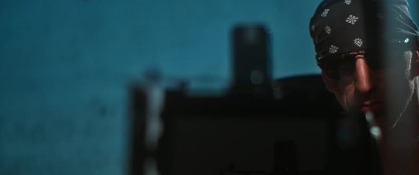 Cinematographer in Rock Style Outfit Filming with Camera |   4K, 12 Bit Braw Video Available