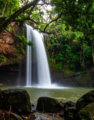 Lush waterfall cascading into a tranquil pool
