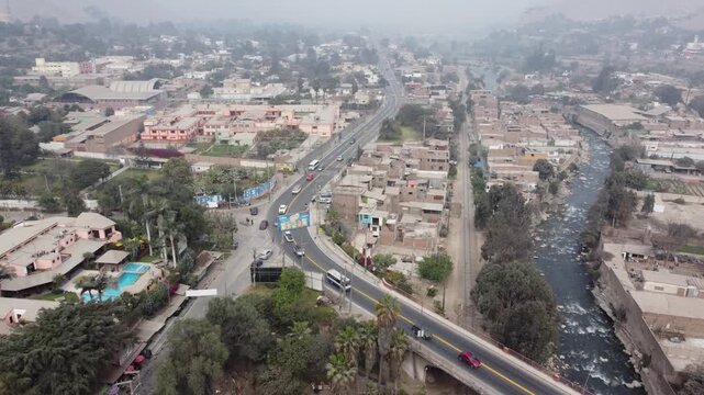 Aerial view of chosica town in lima with river and traffic