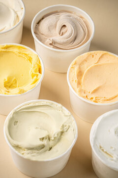 Assorted artisan ice cream in white cups