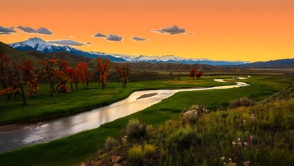 Scenic mountain landscape at sunset with river winding through meadow